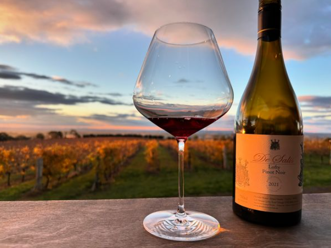 De Salis Lofty Pinot Noir glass and bottle at sunset — Mount Canobolas, Orange NSW